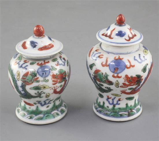 A near pair of Chinese miniature wucai baluster jars and covers, late 19th/early 20th century, 7.5cm